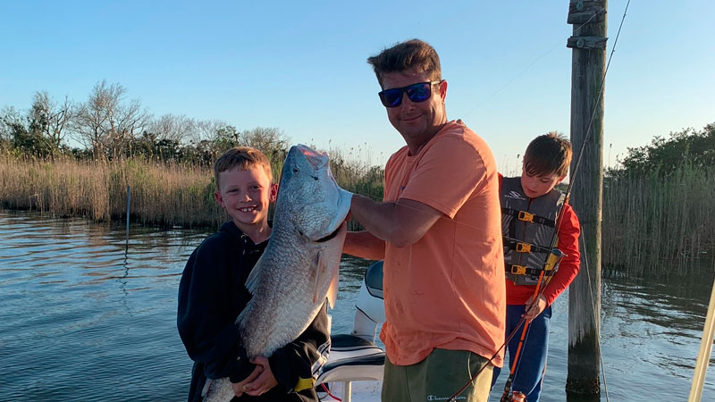Calvin Bordelon, 8, reeled in this huge bull red in Cocodrie with the help of his T-Nonc, Travis Gremillion.