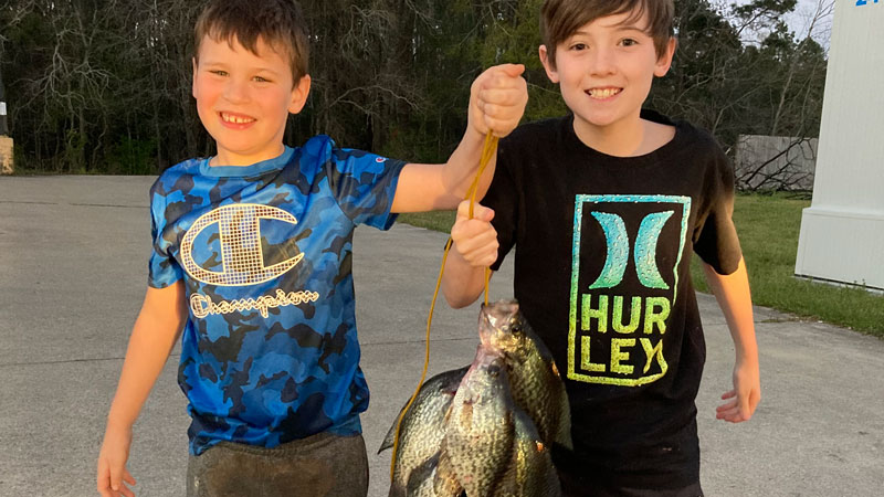 Brothers Judah Craig and Jaxson Walker with fish caught from a Denham Springs pond on jigs fished 2 feet under a cork back in March 2022.