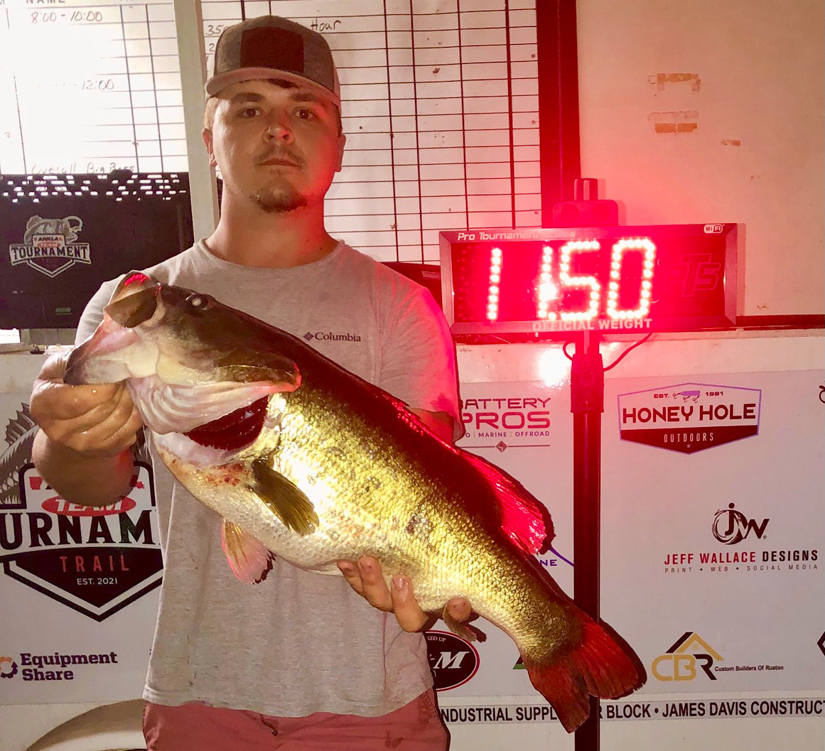 Stockton Roberson with his 11.50-pound Lake Claiborne largemouth that was the Majestic Big Bass winner.