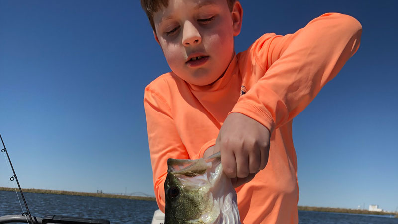 Mason Metzger with his personal best bass, this 3.5-pound largemouth, caught out of Bayou Bienvenue on a live shrimp under a cork.