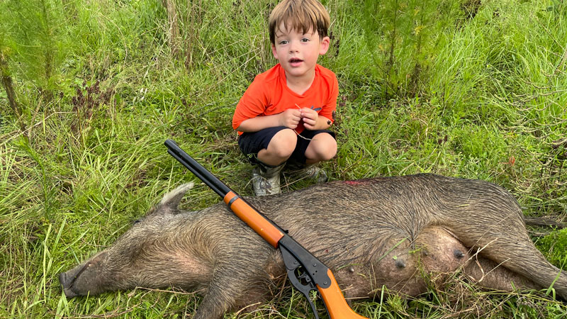 William Shread enjoying the summer hog patrol with his dad in Norwood, La.