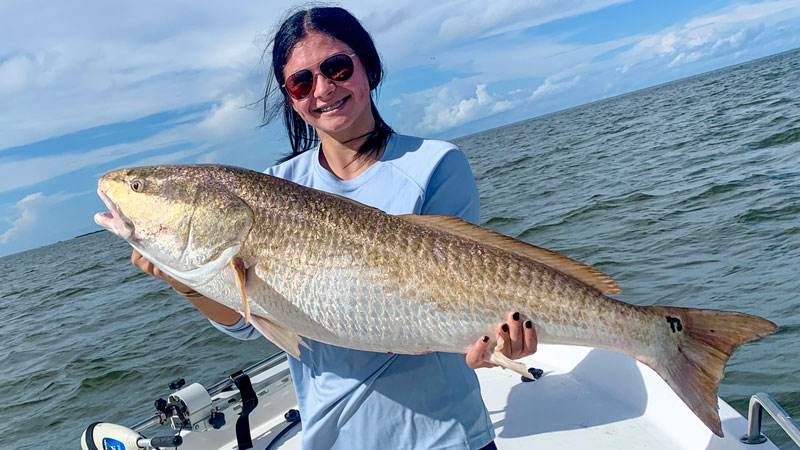 Cristiana Suarez with a bull red that weighed around 25 pounds caught at Grand Isle, La.