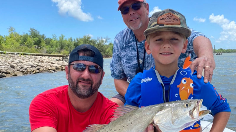 John Allen Francois, 6, was fishing on Big Lake in August when he hooked his first speckled trout, this 3-pounder, on live shrimp.