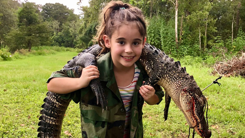 Juniper Stewart, 8, got her first alligator, a 5 1/2 footer, in the Grande River in Bayou Pigeon back in mid-September.