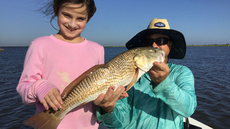 Ava Catherine and her dad, Charles Dubroc, with Ava's beautiful red caught at the far south end of Lake Boudreaux.