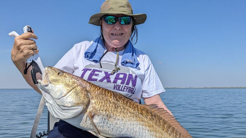 Nancy Roy caught her first redfish near the Cameron jetties.