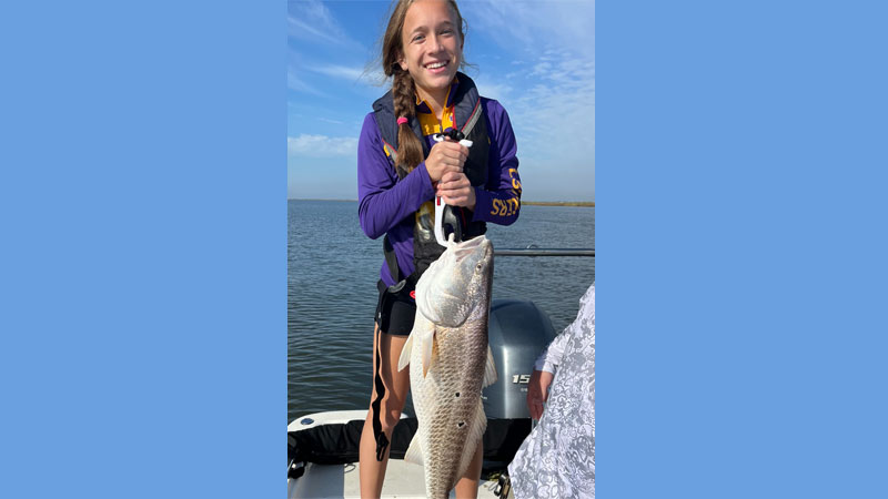 Londyn Guillot of Mandeville with a 19lb redfish caught at the Rigolets.
