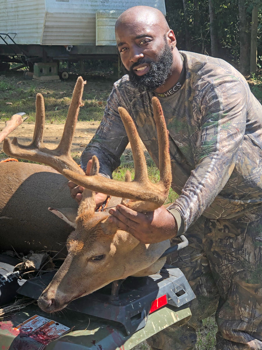 Melvin Brown Jr. of Patterson has his hands full of velvet horns after he shot a 9-point, 215-pound buck Sept. 16 on a lease near Fayette, Mississippi.