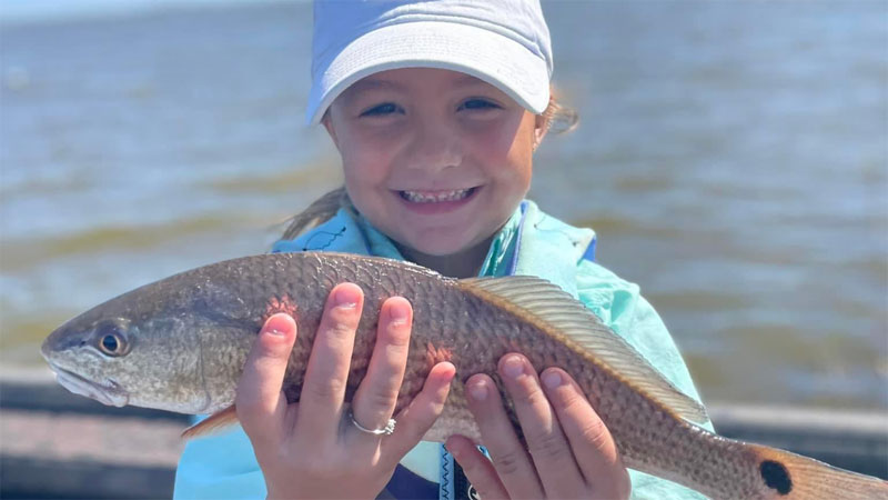 Five-year-old Shiloh Pitre caught her first redfish by herself in Pointe-aux-Chenes on Oct. 19.