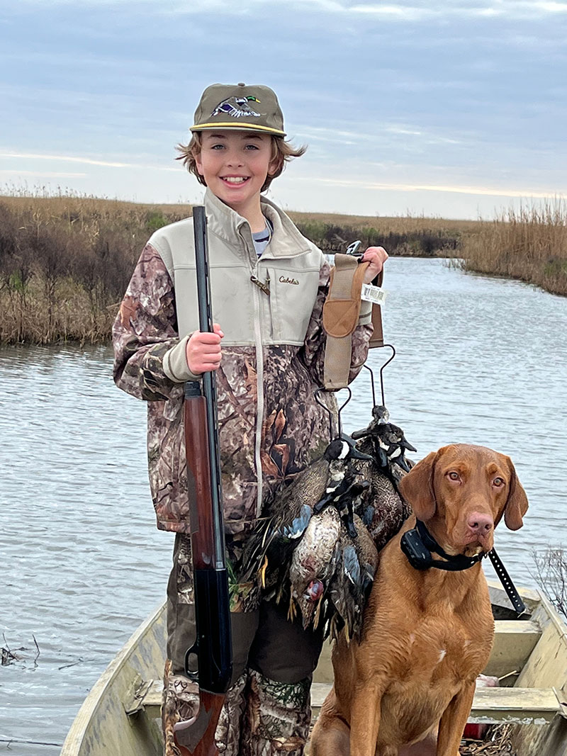 Tucker and Striker with a limit of ducks - Louisiana Sportsman