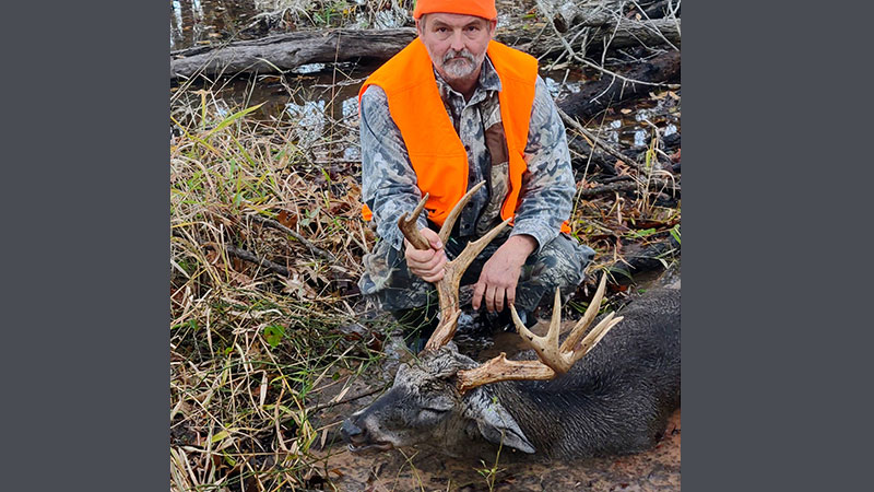 James McMillian with his 12-point buck harvested with a primitive gun at Loggy Bayou WMA in Bossier Parish on Nov. 29, 2022.