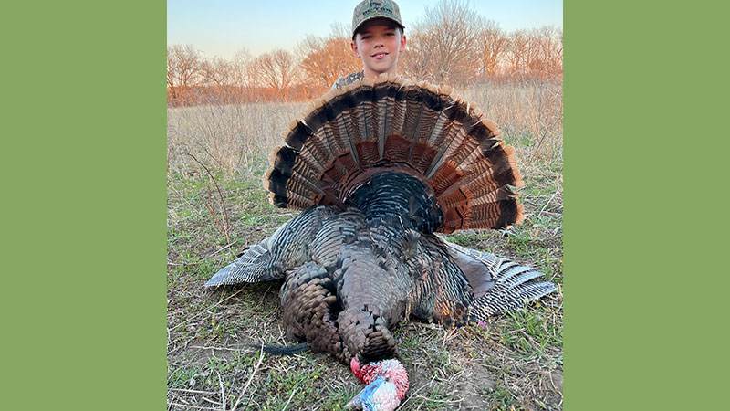 Hagan Michael Hay, 9, with an Eastern and a Merriam's turkey that was included in his single season Grand Slam this year.