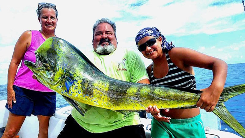 Chuck Cole and his family with a 33-pound gorgeous dolphinfish caught out of Venice on July 14, 2023.