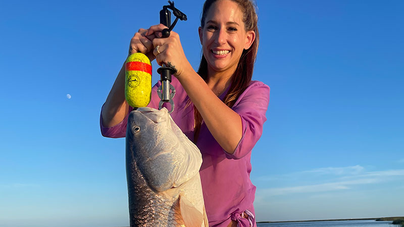Kelli Chauvin with a 28-pound bull red