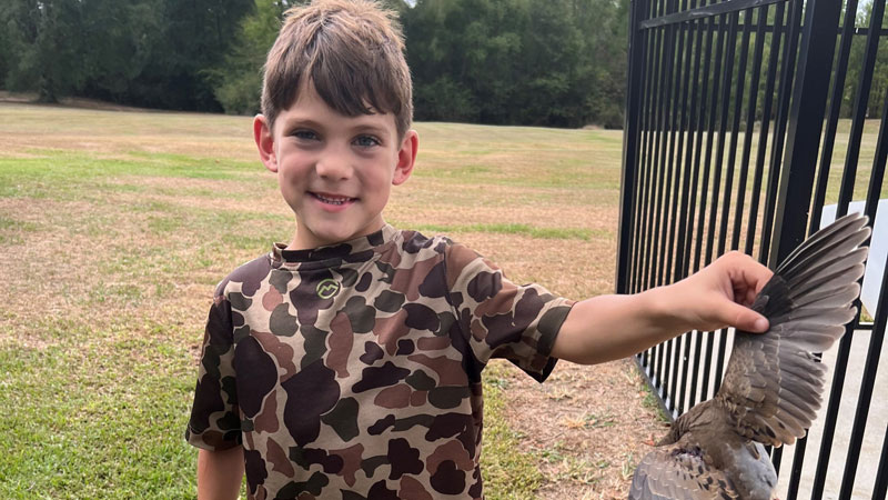 Hank Morgan, 6, killed his first dove at his house during his family's annual dove hunt.