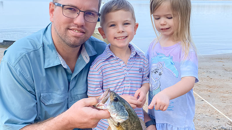 Cash Watson with his dad, Garrett Watson, and sister, Monroe Watson, at Lake Sam Rayburn holding Cash’s big catch.