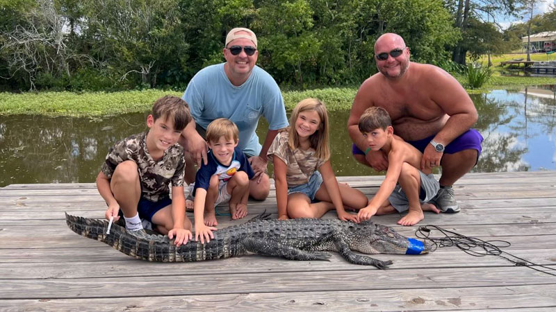 Charlie Morgan, 12, Oliver Hearald, 7, Marley Hearald, 11, and Hank Morgan, 6 helped there dads and moms catch some gators at Lake Bruin.