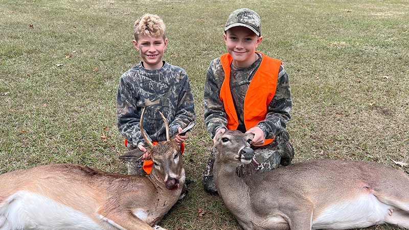 Eight-year-old Levi Thomas with his first deer and 11-year-old Tucker Thomas with his second deer taken on Nov. 21 in Winn Parish.