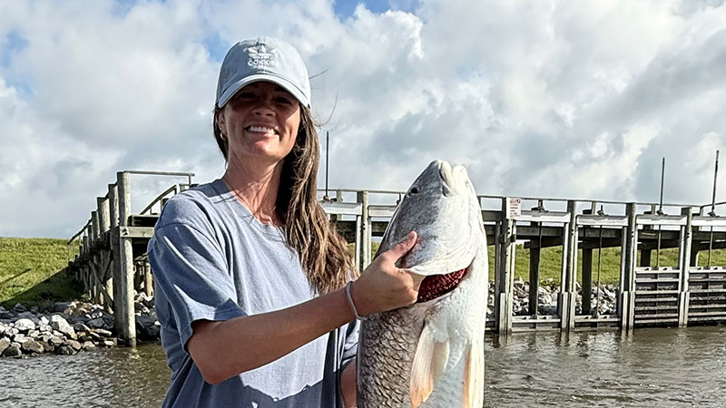 Amber McCallon holds the 38-inch Dulac redfish she caught and released on Oct. 19.