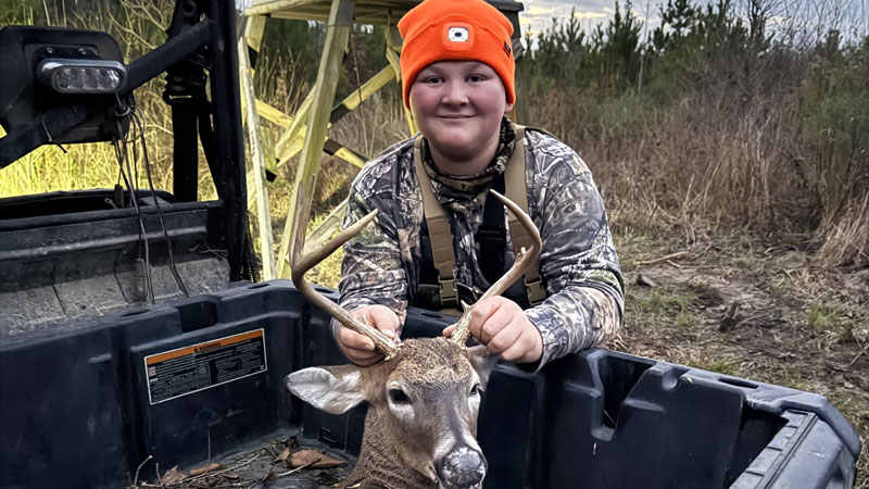 Jack Lyons poses with his nice buck.