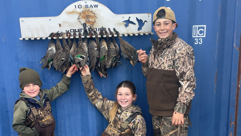 Siblings Easton, 12, Edge, 6, and Eibilene, 10, Menard with ducks killed in Whiteville (between Ville Platte and Bunkie) on Nov. 29.