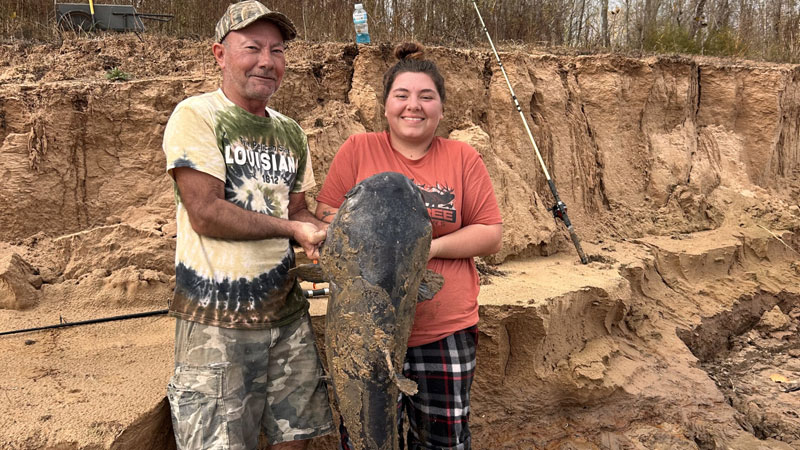 Jade Lavergne of Bordelonville with her dad, Joseph Lavergne, and a big catfish they caught on Dec. 25