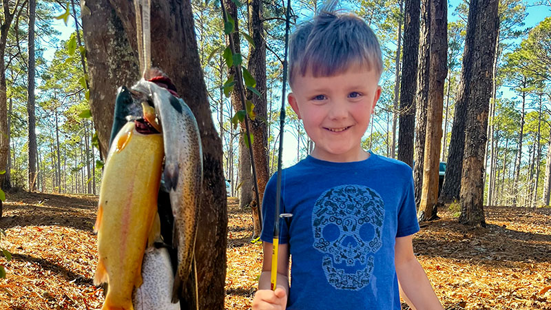 Silas Tam and his dad catch rainbow trout