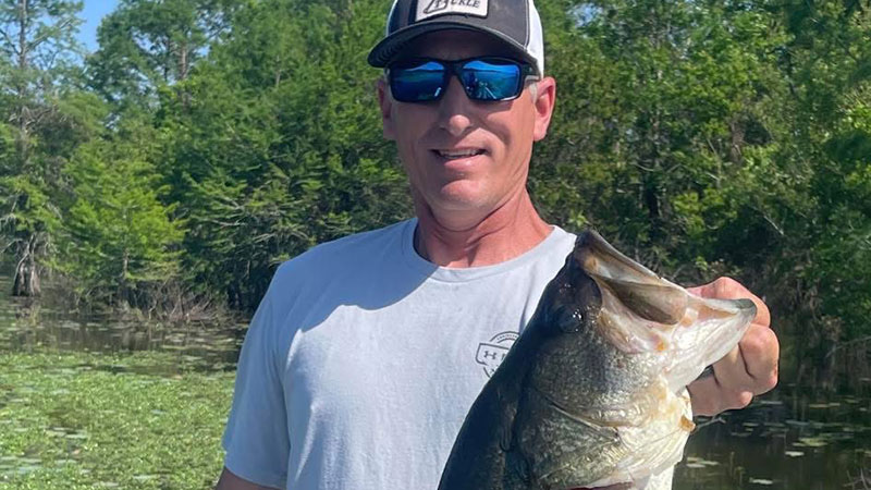 Michael Keller with the 8.13-pound lunker bass he caught at Toledo Bend.