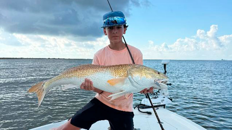 Brayden Callegan with a bull red caught at Oyster Bayou on July 3, 2026.