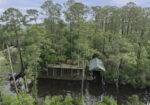 1.98 Acre Waterfront Double Lot in Slidell with Two-Story Boat Dock, Lift, and Much More!