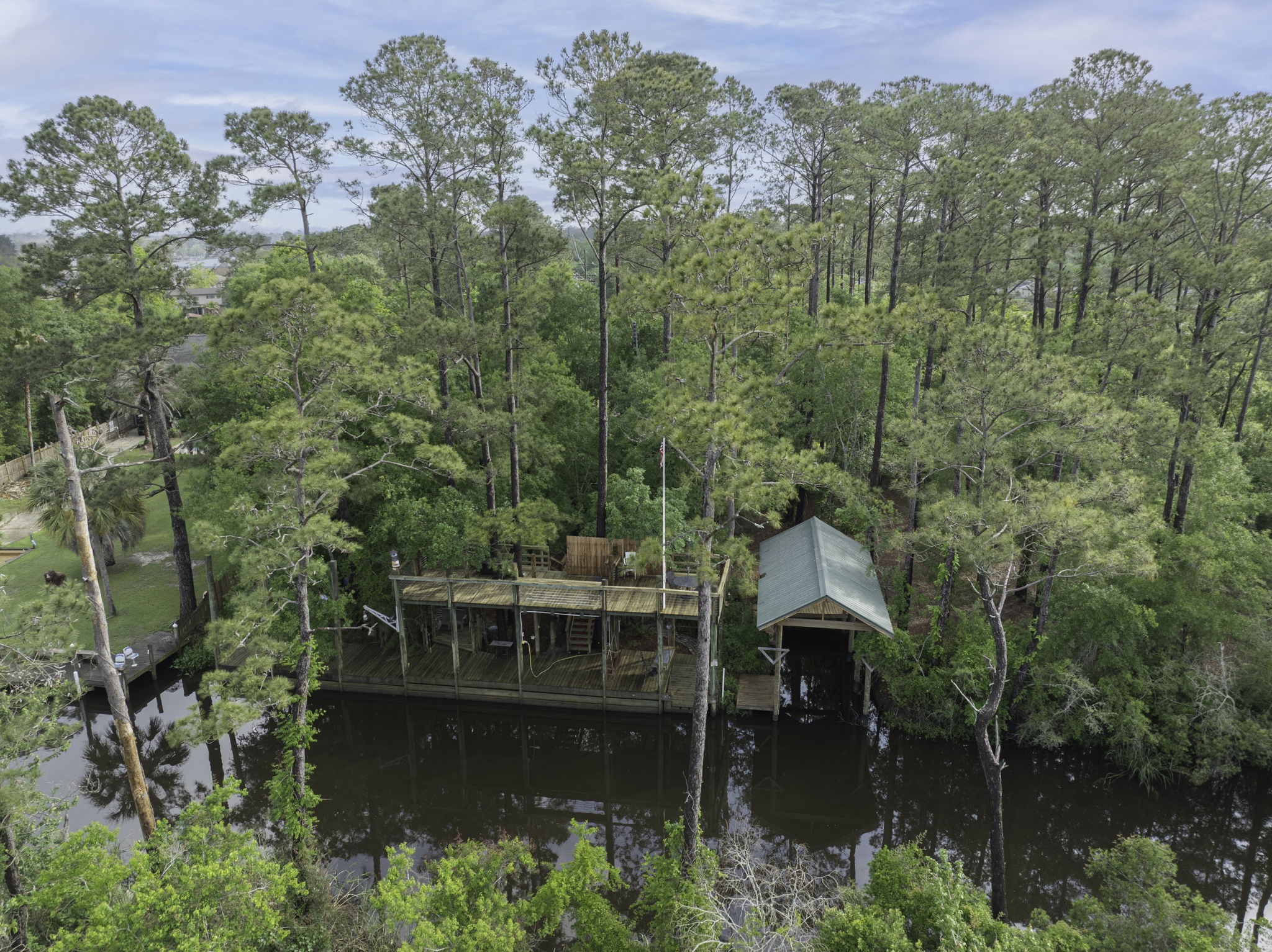 1.98 Acre Waterfront Double Lot in Slidell with Two-Story Boat Dock, Lift, and Much More!