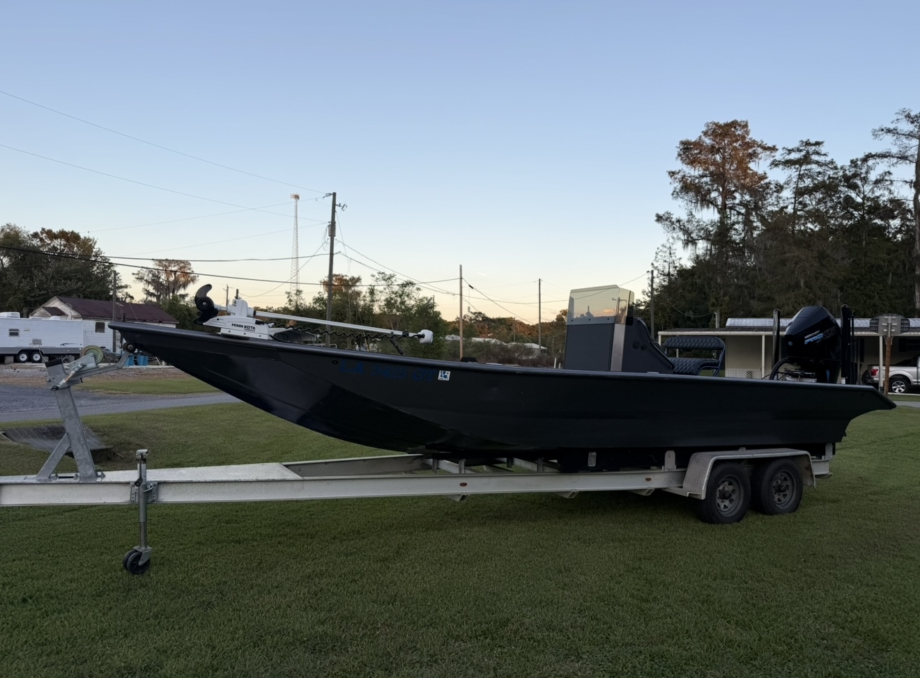 27’ x 7’ Uncle J Bay Boat with trailer, loaded and ready to fish!